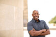 © digitalskillet1 - Happy mature African American man smiling outside.