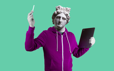 Modern art collage. Concept portrait man holding tablet and pencil. Gypsum head of Apollo.