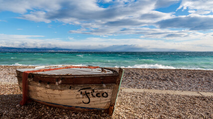 Sticker - Wooden boat on the seashore