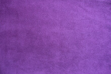 Texture of violet faux suede fabric from above