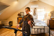 © Mint Images - Teenage girl playing her violin in her bedroom