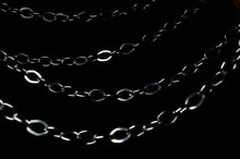 Metallic Silver Chains Isolated On A Black Background