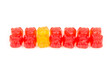 © Olga - Children's vitamins in the form of bears are arranged in rows. A lot of multi-colored jelly sweets for children.