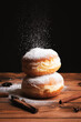 Donut with dropping powdered sugar
