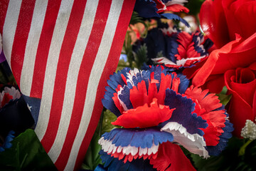 Wall Mural - Red White and Blue American Patriotic Background With Flag and Flowers.