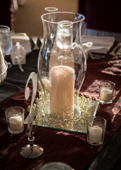 Candle in a glass vase center piece