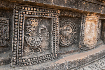 Sticker - Myanmar, Bagan. Historic Archaeological Zone near Le-myet-hna temple area. Temple detail, stone carved peacock.