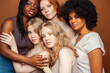 © iordani - young pretty caucasian, afro, scandinavian woman posing cheerful together on brown background, lifestyle diverse nationality people concept