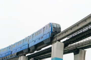 Wall Mural - Light rail runs on bridges at high speed in Chongqing, China