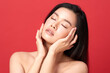 Beautiful young asian woman with clean fresh skin on red background, Face care, Facial treatment, Cosmetology, beauty and spa, Asian women portrait