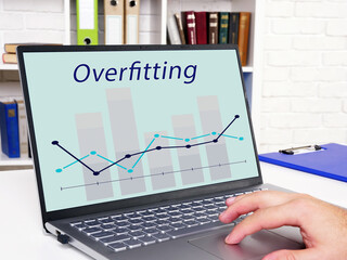 Business concept about Overfitting with sign on the page.