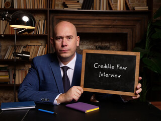 Wall Mural - Financial concept meaning Credible Fear Interview with sign on chalkboard.