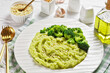 broccoli potato mash on a white plate