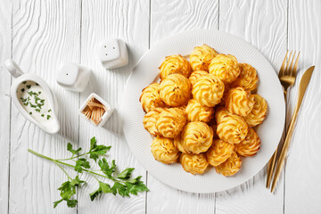 Duchess potatoes served on a white plate