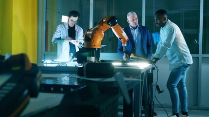 Wall Mural - international team of scientists are observing a robotic arm