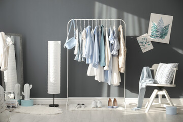 Poster - Dressing room interior with clothing rack and mirror