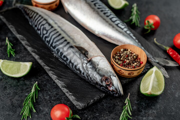 Fresh raw mackerel fish on stone background