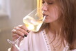 © Pretti - Girl drinking white wine