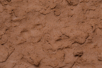 Wall of soil house. texture of clay house structure. Mud background, selective focus. soft picture