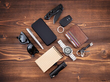Flat Lay Of EDC Or Every Day Carry Items And Tools On Wooden Background