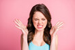 Portrait of angry stressed brunette long hair style girl suffer from pain wear blue top isolated on pink color background