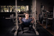 © Joachim - man lifting heavy weights in a gym
