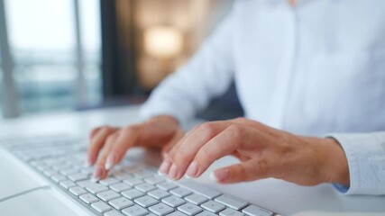 Female hands typing on a computer keyboard. Concept of remote work.