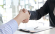 © Puwasit Inyavileart - Close-up hand to hand, Congratulations on joining the new employee, Welcome with a handshake, Express their joy in being able to qualify for a new employee's job in the company, Good deal.