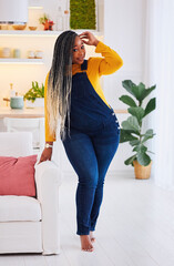 attractice plus size african american woman posing at home