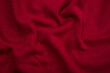 Pleats on fabric, knitted material of Crimson color, folds