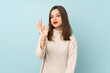 © luismolinero - Teenager girl isolated on blue background showing an ok sign with fingers