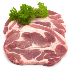 Wall Mural - Raw pork neck chop meat with parsley herb leaves garnish isolated on white background cutout