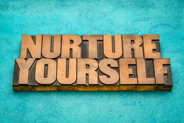 Sticker - nurture yourself - inspirational word abstract in vintage letterpress wood type, self-care concept