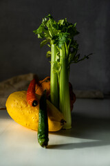 Wall Mural - vegetables: zucchini, patison, avocado, pepper, celery on the table