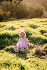 Wall Mural - Baby girl wears rabbit ears.