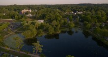 Aerial Tilt Down Of Heckscher Park Pond In Huntington Long Island