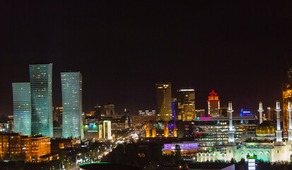 Poster - Night view of Northern Lights apartment buildings and Nur Mosque in the city center, Astana, Kazakhstan