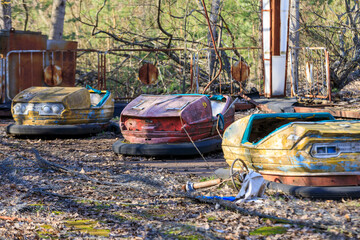 Poster - Ukraine, Pripyat, Chernobyl. Bumper cars at abandoned amusement park.