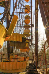 Poster - Ukraine, Pripyat, Chernobyl. Abandoned amusement park, chairs on a ferris wheel.