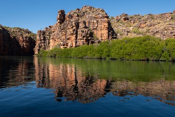 Wall Mural - Western Australia, Kimberley Coast, Koolama Bay. Typical red rock landscape on the King George River with scenic reflections.