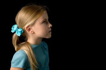 Profile portrait adorable blonde girl