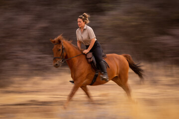 Poster - Slow pan of blonde trotting past trees