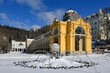 Great Czech spa town Marianske Lazne (Marienbad) in winter - colonnade, fountain and pavilion of mineral water springs under snow