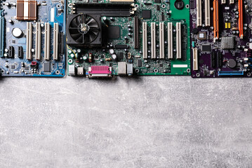 Poster - Computer motherboards on light grey table, flat lay with space for text. Electronic device
