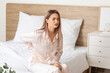 © Pixel-Shot - Young woman suffering from back pain in morning because of uncomfortable mattress