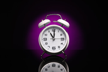 Alarm clock on black background