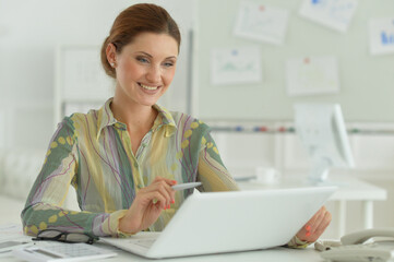 Portrait of a beautiful young woman working