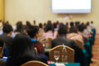© themorningglory - Blurred people sitting in business seminar room in hotel