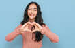 canvas print picture - Hispanic teenager girl with dental braces wearing casual clothes smiling in love doing heart symbol shape with hands. romantic concept.