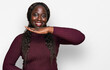 © Krakenimages.com - Young african woman wearing casual winter sweater gesturing with hands showing big and large size sign, measure symbol. smiling looking at the camera. measuring concept.